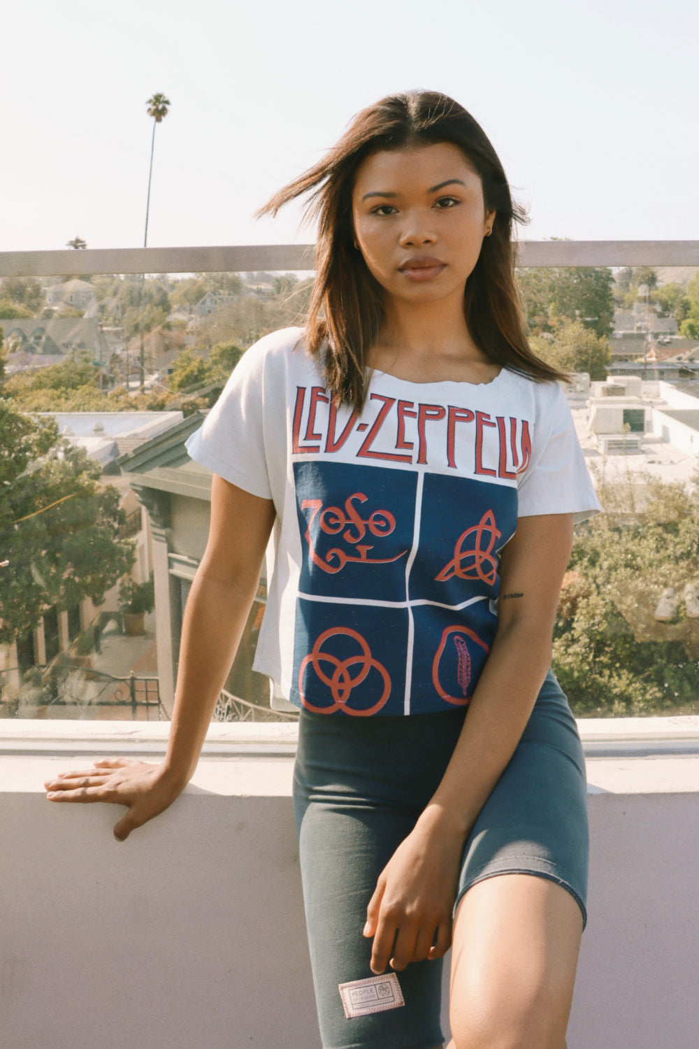 Sky blue Zoso Led Zeppelin crop tee featuring iconic symbols, made from 100% organic cotton.